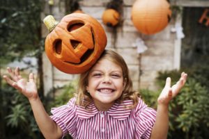 girl with jack-o-lantern